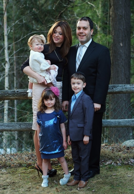 Sholom Jacobs with his wife, Pessy and children, Shmuel, Chana and Dina.