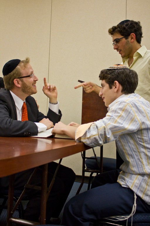 Rabbi Tzvi Wachsman raises a point with students at the Torah Academy High School.