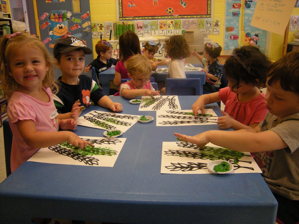&quot;Students in Morah Shani's Nursery Aleph class at HANC Early Childhood Center, in West Hempstead, get ready for Sukkot and Simchat Torah by painting a lulav and thumb painting hadassim.&quot;