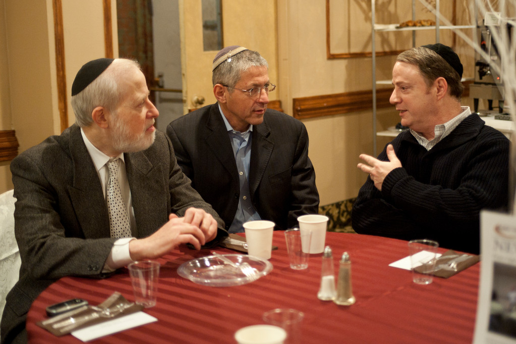 Col Geva Rapp talks with supporters such as Yaackov Safier of Far Rockaway (right) at the Panim El Panim breakfast held at Congregation Kneseth Israel this past Sunday.