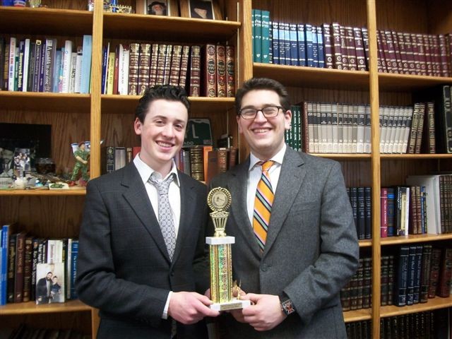 Mathew Goldstein (l) and Hillel Friedman proudly display their trophy earned at the debate tournament.