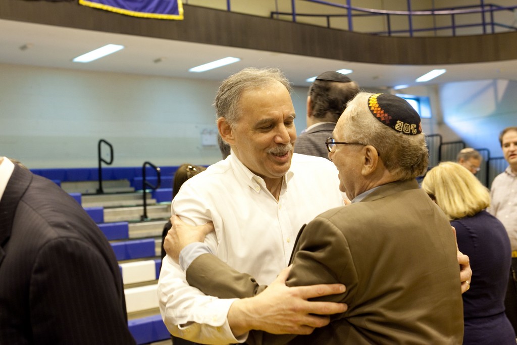 YU basketball alum Jerry Joszef greets Danny Halpert, coach&rsquo;s brother.