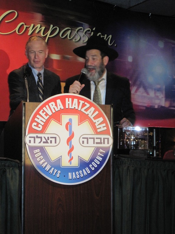 Hatzalah appreciated  Nassau County Legislator Howard Kopel (LD 7) presents a proclamation to Rabbi Kanner, Hatzalah coordinator, at Chevrah Hatzalah&rsquo;s 31st Annual BBQ Dinner that took place at the Sands of Atlantic Beach on Sunday, May 6, 2012.  The event&rsquo;s huge turnout was an expression of appreciation for the amazing group of volunteers and by extension reflects their integral role in the community at large.