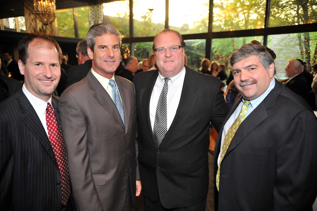 Board members Craig Spatz, Steven J. Spiro, Eric Keslowitz, and Bob Block celebrate at 10th annual dinner.