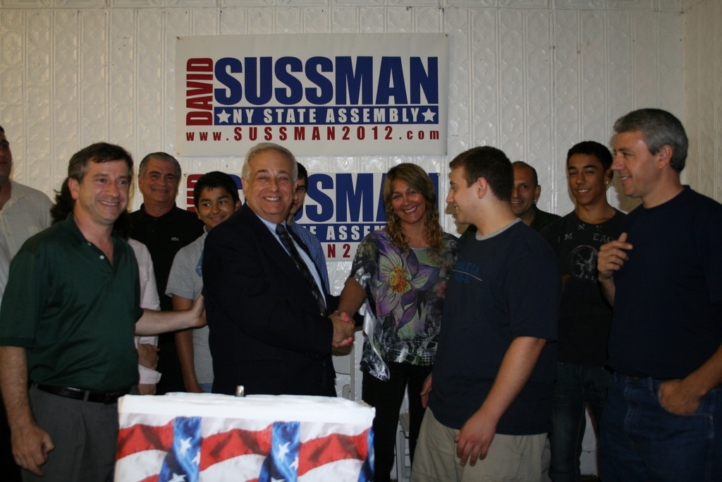 David Sussman, Republican candidate for New York State Assembly, District 20, greeting guests at the opening of his new campaign headquarters. Left to right: Uri Kaufman, Sarah Yastrab, Michael A. Perone, Jr., Kevin Rodriguez, David Sussman, Andrea Dojanian, Sam Sussman, Noberto Rodriguez, Agustin D&rsquo;Andrea, Daniel D&rsquo;Andrea.