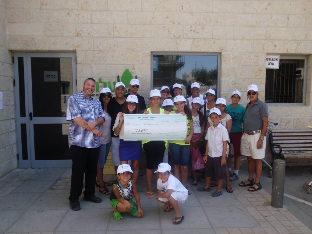 Just three months after their walk-a-thon on the Atlantic Beach Boardwalk kicked off an inspired Bar/Bat Mitzvah Project, representatives from the 6th grade class at The Brandeis School presented a check to the campaign&rsquo;s beneficiary, ALEH (www.ALEH.org), Israel&rsquo;s largest network of facilities for children with severe cognitive and physical disabilities. The student-run project raised NIS 20,000, which will help ALEH pay for the specialized therapies needed to treat the children in the Jerusalem facility.