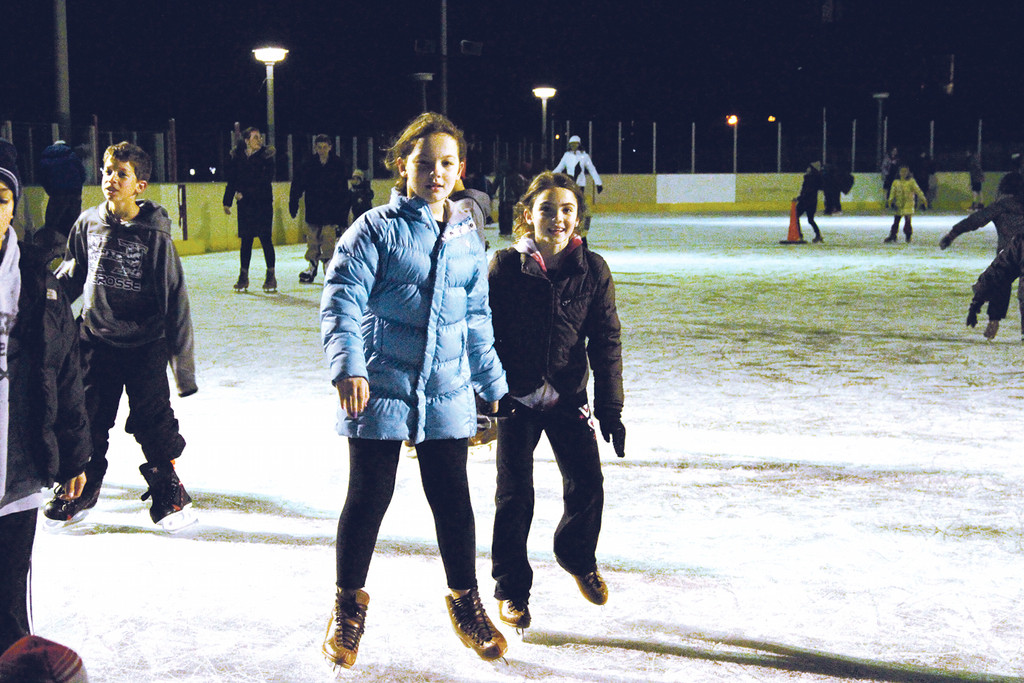 Zoe Staschnow and Toni Busso enjoy Chanukah on ice at Grant Park.