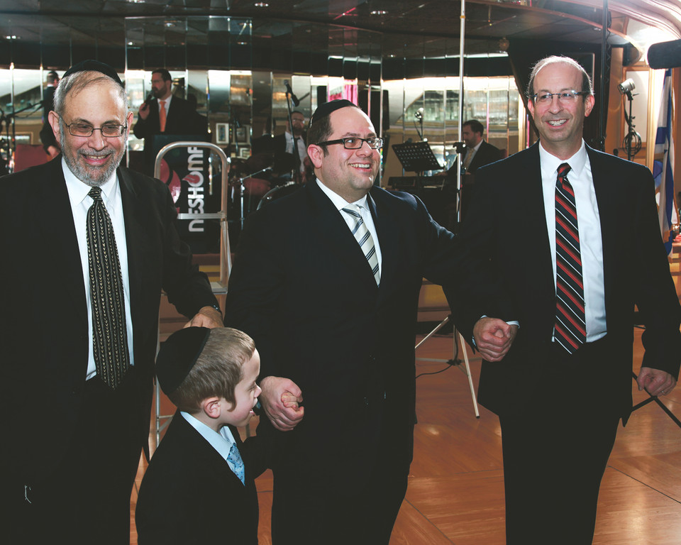 Ari Hirsch celebrates Young Israel of West Hempstead&rsquo;s 57 years with son Dovie , Rabbi Yehuda Kelerner and Bob Marguilies.