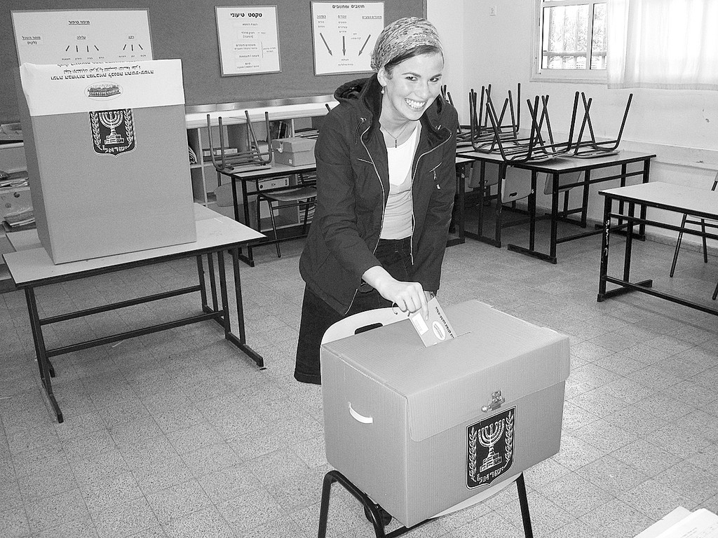 Another former Five Towner, Ariella, is seen exercising her right to vote on   election day at a polling station in a local school in Israel this past Tuesday.