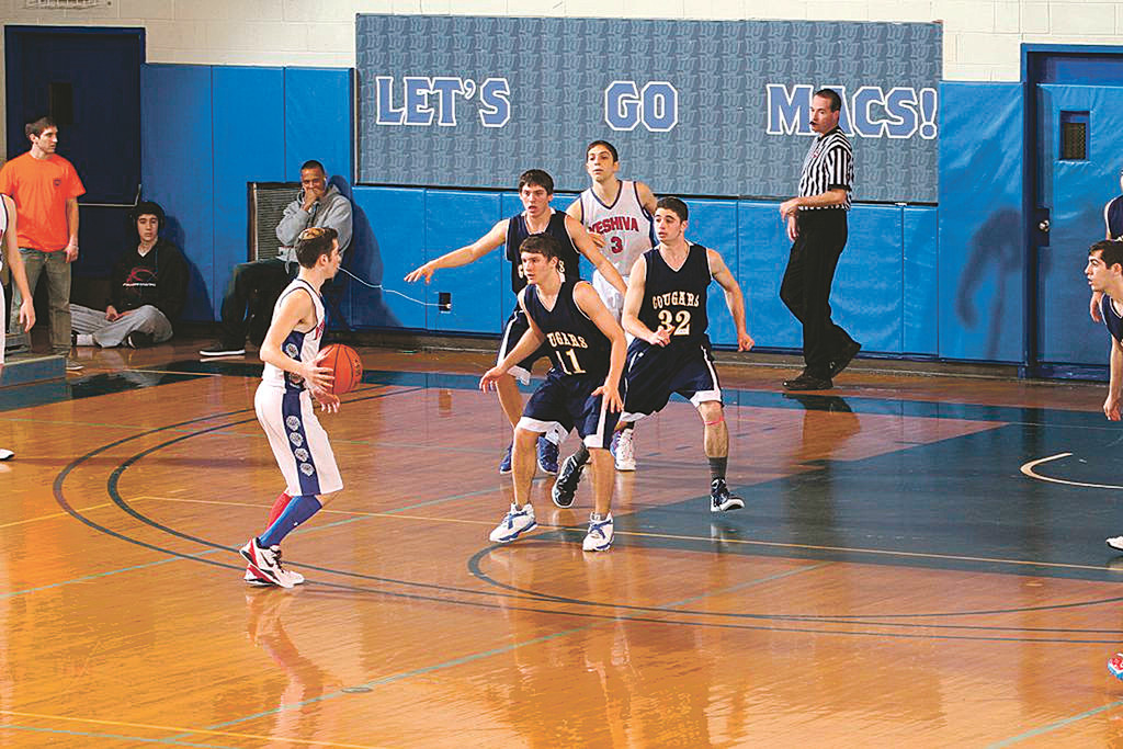 Melvin J. Berman Hebrew Academy Cougars defend against the YUHS Lions