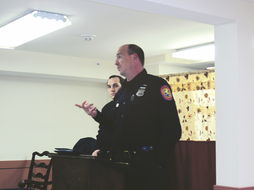 From left Police Officer Bob Kohlmeir, and  Police Officer Robert Chimienti, speaking about community safety issues