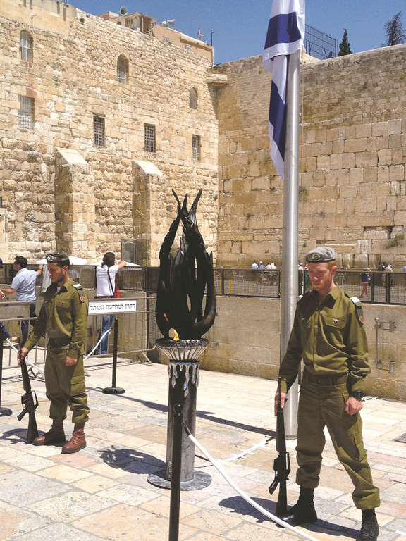 Two soldiers, sporting sfira beards, standing guard at the Kotel on Yom Hazikaron, Memorial Day in Israel.