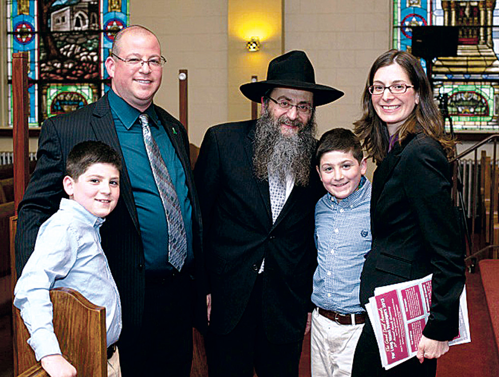 Guest Speaker Andrew Paley with his wife Shari and twin children Ethan &amp; Benjamin who were in school that day in Sandy Hook Elementary School in Newtown CT.  Rabbi Anchelle Perl is at center.