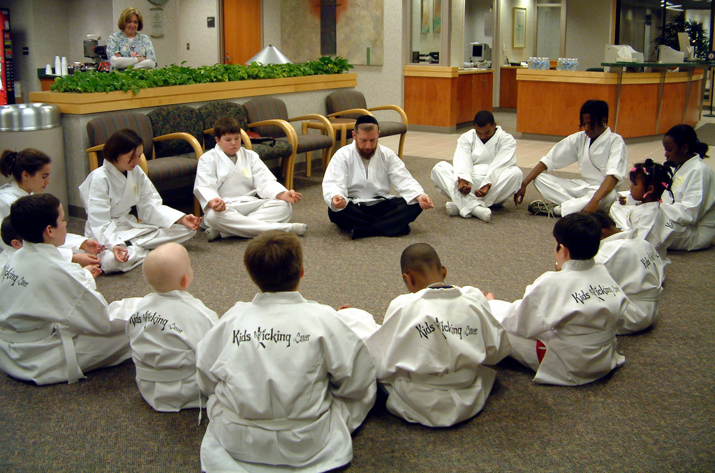 Children at St. Joseph Mercy Hospital in Bloomfield Hill, Michigan, gather in a circle with Rabbi Elimelech Goldberg.