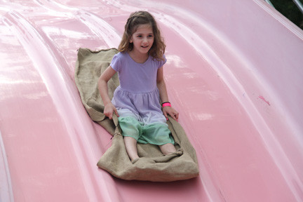 Talia Ross takes a ride on the giant slide.