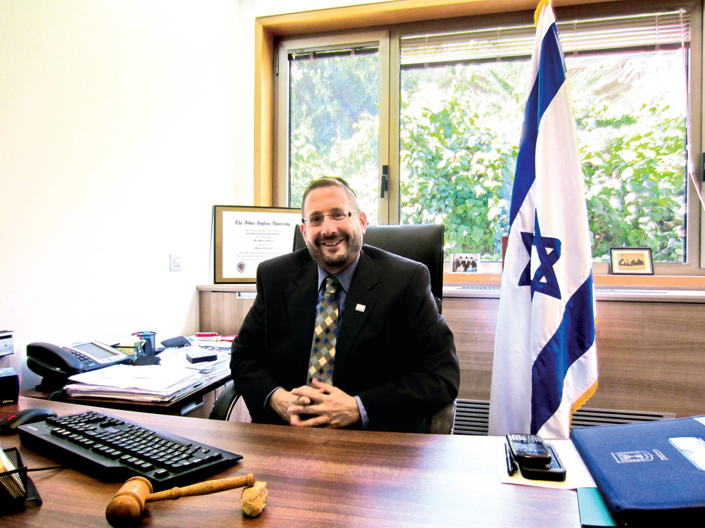 Dov Lipman welcomes visitors to his Knesset office between meetings.