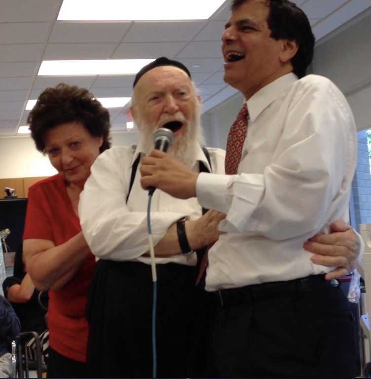100-year-old Abraham Antman danced with his daughter and Yoel Sharabi, master performer of modern Israeli and Chassidic melodies, at an concert for residents of Margaret Tietz Nursing and Rehabilitation Center in Jamaica Hills.