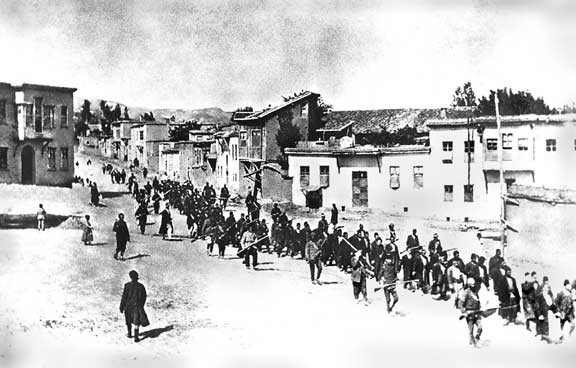 Armenians are marched to a prison in Mezireh by armed Turkish soldiers in Kharpert, Armenia, in 1915.