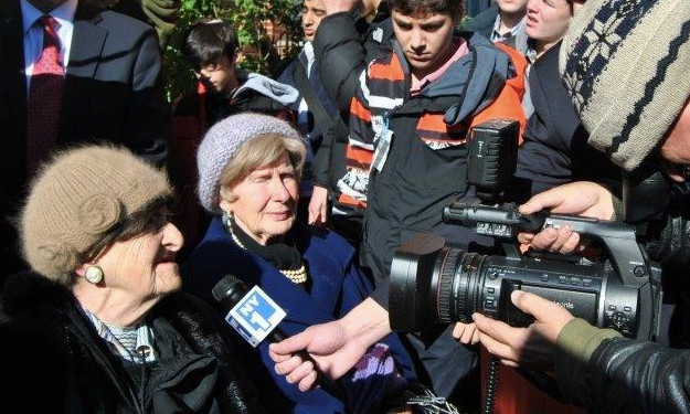Two Holocaust survivors are interviewed by NY1 as Rambam students and others protest the continued residence of a 91-year-old Nazi in Jackson Heights.
