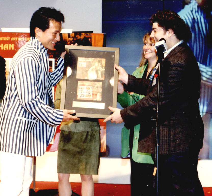 Jackie Chan, left, and Lonnie Ostrow in Hong Kong in 1998. Ostrow cannot remember failing to light the Chanukah candles