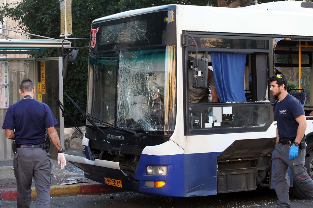 Israeli police and rescue personnel at the scene of an explosion on a passenger bus in Bat Yam, near Tel Aviv, on Dec. 22.