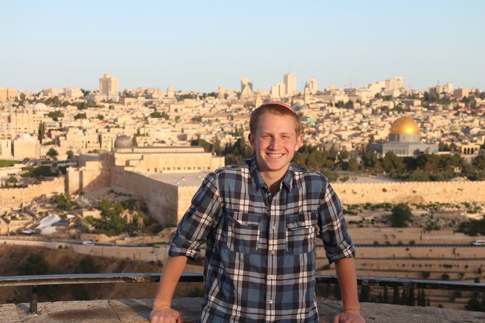 Oleh, IDF recruit and former Five Towner Gavi Nelson poses across from the Temple Mount.