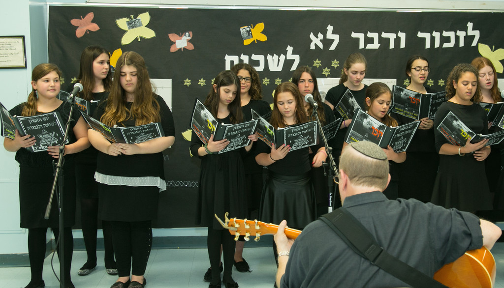 HAFTR Middle School choir sang as a background to images of the concentration camps.