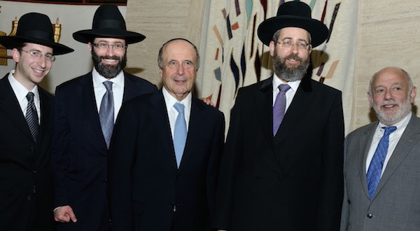 At the White Shul, from left: Assistant Rabbi Shaya Schechter, White Shul Rav Rabbi Eytan Feiner, Lawrence Mayor Martin Oliner, Chief Rabbi David Lau, and White Shul president Chaim Leibtag.