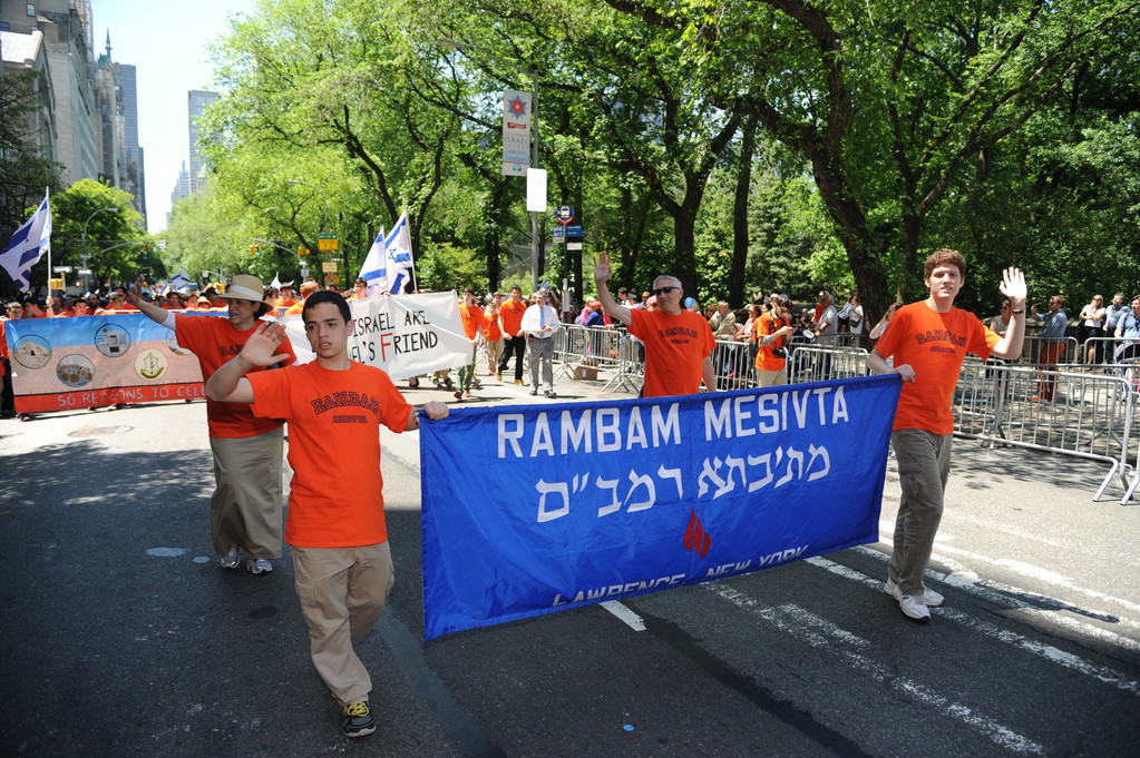 Lawrence-based Zionist, activist, Rambam Mesivta High School for Boys danced and sang along the parade route and held a banner proclaiming,