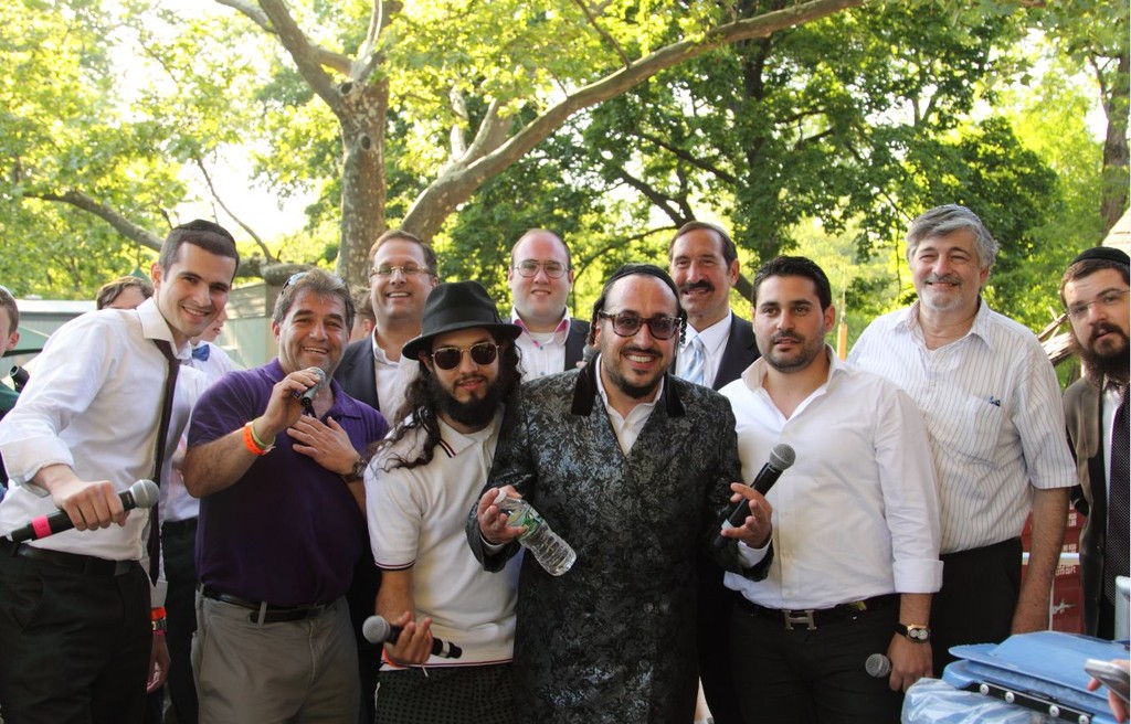 Performers and organizers of the 21st annual Israel Day Concert: Front l-r: Chazzan Yaakov Rosten, Chaim Kiss, Rapper Ari Lesser, LIPA, Gad Elbaz, Concert Chairperson Dr. Paul Brody, and singer Benny Friedman. Back l-r: Shloime Dachs, Nachas, and Concert Organizer Dr. Joseph Frager.