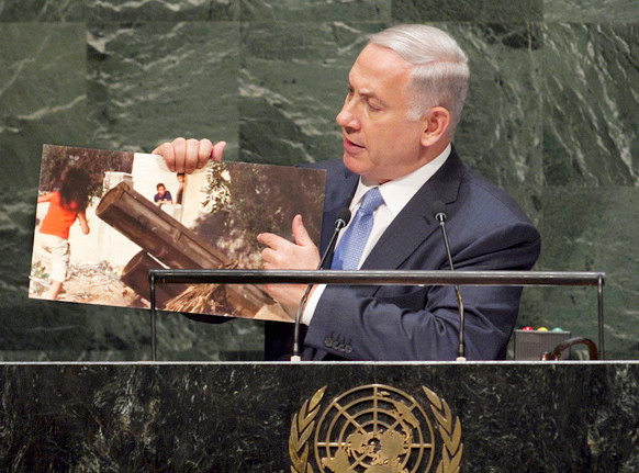 Prime Minister Netanyahu, at the U.N. General Assembly on Monday, points to a picture of a Palestinian rocket launcher in a civilian area of Hamas-controlled Gaza.