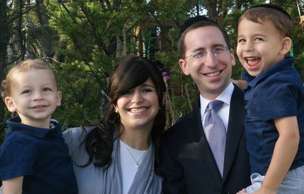 Rabbi Shay Schachter with his wife, Rina, and children Yehuda and Yosef Shalom.