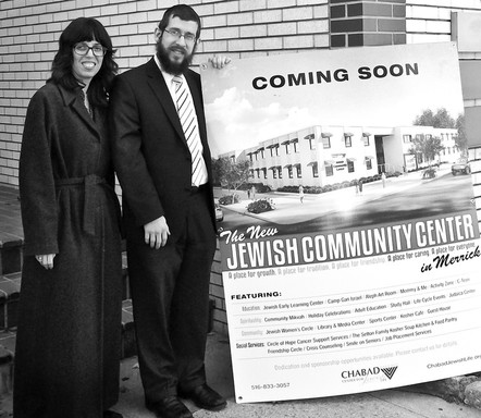 Chanie and Rabbi Shimon Kramer outside the building Chabad bought for $2.75 million.