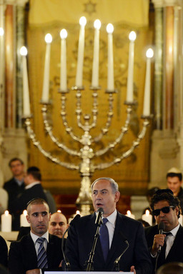 Prime Minister Netanyahu speaks during a ceremony for the victims of last week's terror attacks, on Sunday in Paris' Grand Synagogue.