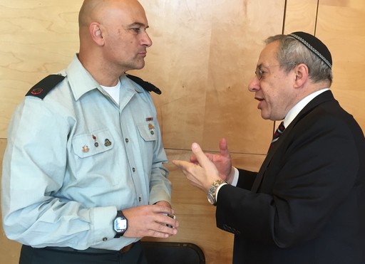 YIW Rabbi Hershel Billet speaks with Special in Uniform Director Tiran Attia on Sunday.