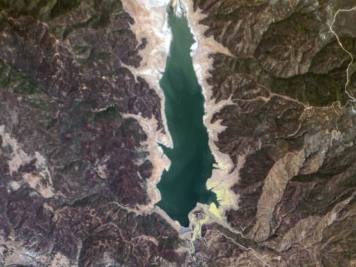 A satellite image of a reservoir in California. In a non-drought year, according to Planet Labs, the visible water would cover roughly twice the area as it does in this picture.