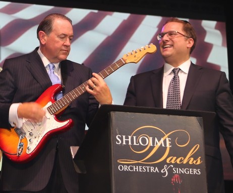 Gov. Mike Huckabee, who played his guitar on his former FoxNews program, joined the Shloime Dachs Orchestra for a quick number at the Israel Day Concert on SummerStage in Central Park.