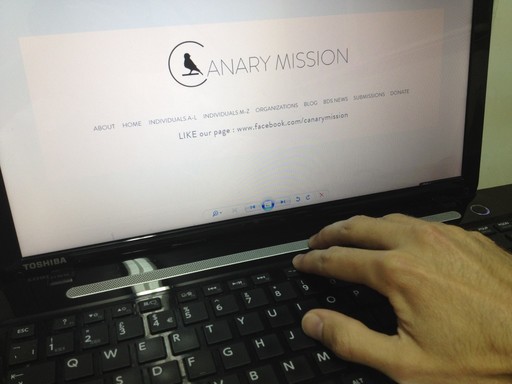 A staffer in the Canary Mission office prepares to check a profile.