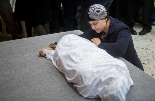 Adva Biton, mother of Adele Bilton, a 4-year-old Israeli Jewish victim of a Palestinian rock-throwing terror attack, cries over her daughter's body in February 2015.