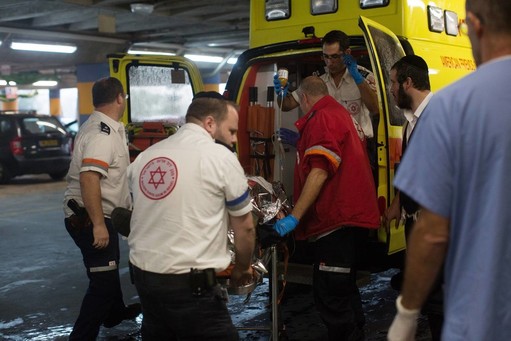 Paramedics wheel a wounded Israeli man into the emergency room of the Shaare Zedek Medical Center on Nov. 6, after he was stabbed by a Palestinian attacker.