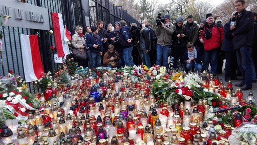 Candles and flowers for the victims of the Nov. 13 Paris attacks outside of the French Embassy in Warsaw.
