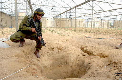 An IDF soldier in 2006 at a tunnel uncovered during an Israeli counter-terrorism operation designated to thwart weapons smuggling from Egypt to Gaza through the Philadelphi Route, in southern Gaza.