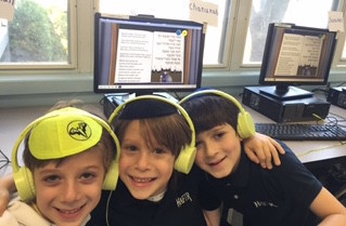HAFTR first graders Max Levine, Zachary Maron and Jacob Stern using interactive features on their iPads, making everyday curriculum come to life.