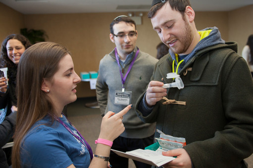 Hundreds register and give a sample of their saliva for genetic screening at Belfer Hall in the Sky Caf&eacute; on Feb. 13.
