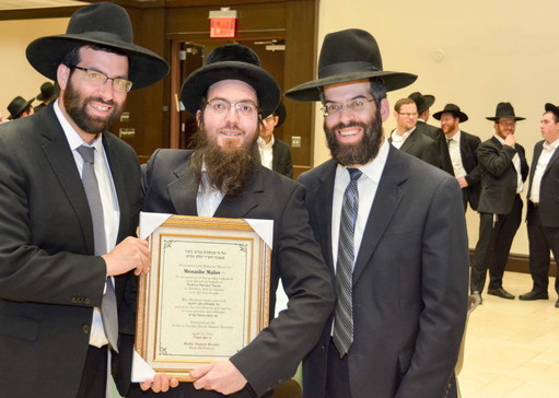 Rabbi Avrohom Bender, Menashe Malov and Rabbi Dovid Bender.