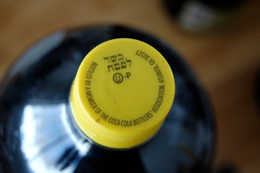 Kosher-for-Passover of Coca-Cola is distinguished from ordinary Coke bottles by its yellow cap.