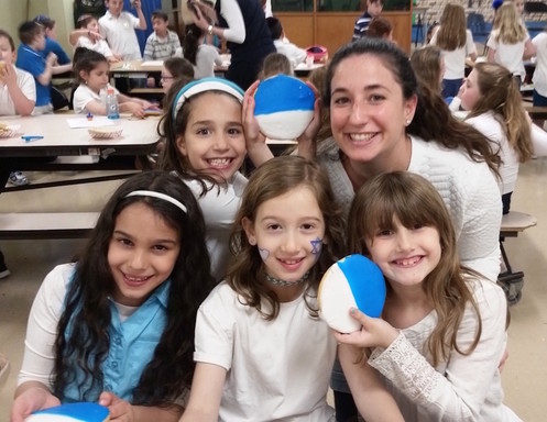 Children at HANC&rsquo;s Samuel &amp; Elizabeth Bass Golding Elementary School in West Hempstead, delighted the holiday's blue and white cookies.