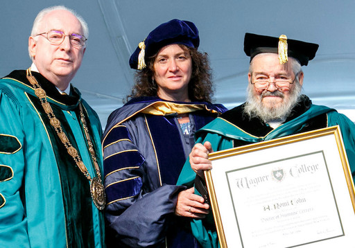 Rabbi A. Romi Cohn receives an honorary doctorate at Wagner College on Staten Island, from Wagner President Richard Guarasci and Professor Lori Weintrob, director of Wagner&rsquo;s Holocaust Education and Programming Center.