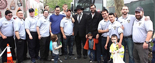 Pictured are RNSP volunteers and (near center) Rabbi Yaakov Bender, Darchei Torah&rsquo;s Rosh HaYeshiva, and his son Rabbi Baruch B. Bender, founder and president of Achiezer.