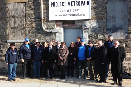 Metropair repairmen and management are pictured at the opening of its warehouse earlier this year.